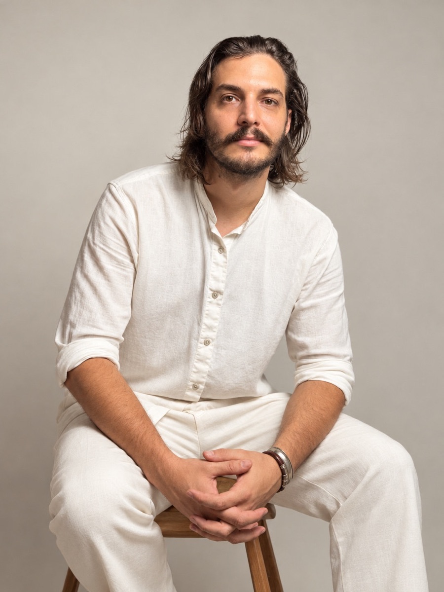 Portrait of Maxime Viellard seated, dressed in white linen